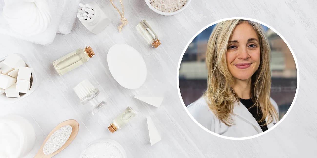 A photograph of dermatologist Dr. Alison Gruen set into a flat overhead spread of various skincare items like cotton swabs and bottles of oil.