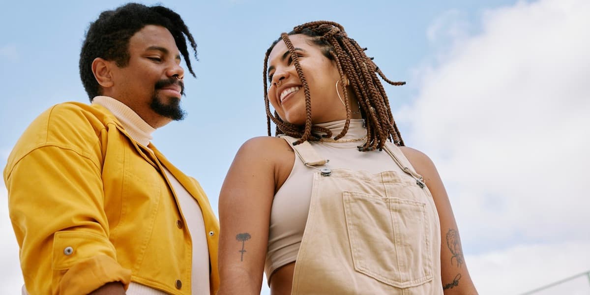 A couple embraces in this article showing how hormone replacement therapy (HT) and GLP-1 treatment offer health benefits to some men and women when taken together.